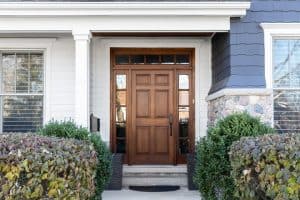 Front door of house, outside view with bushes