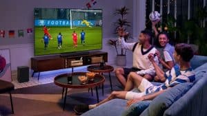Sports fans watching football on TCL QD Mini LED TV