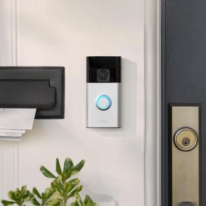 Ring battery powered doorbell mounted on a door frame