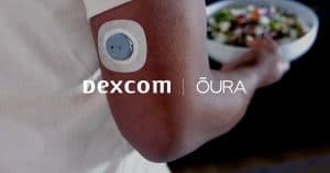 Person wearing a Dexcom glucose monitor and carrying a bowl of salad.