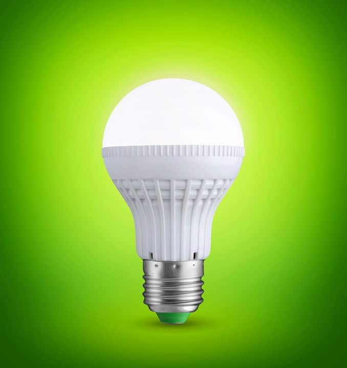 Led lightbulb on green background.